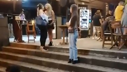 Wearing high heels proves risky as woman stumbles down steps while trying to stay upright