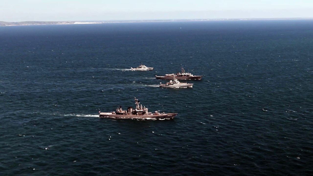 Royal Navy's HMS Enterprise sailing alongside international warships