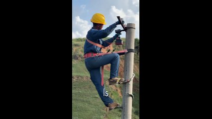 The Job Where Your Office is a Pole on a Cliff | Extreme Lineman Skill
