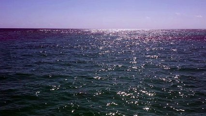 sparkling ocean waters under bright sunlight