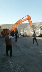 Worker wasn't paid, so he got in a bulldozer and destroyed a whole line of dump trucks.