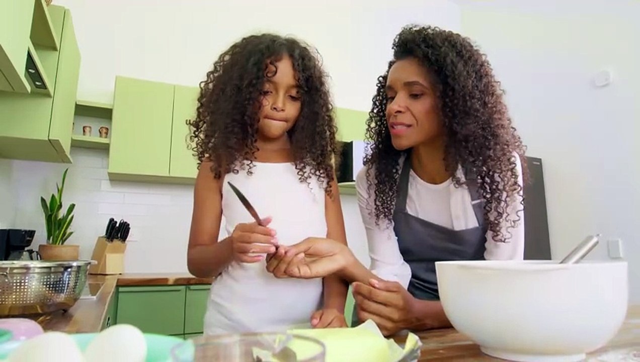 Mom Teaching Little Daughter to Bake