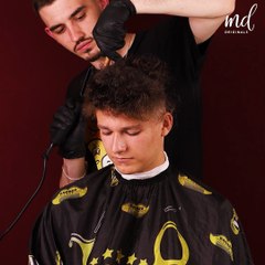 That long curly hair is gone