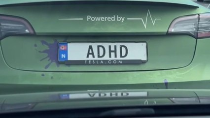 Car plate says 'ADHD' with hilarious 'Powered by' tag above it