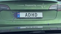 Car plate says 'ADHD' with hilarious 'Powered by' tag above it