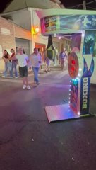 Person Falls Hard While Trying Bicycle Kick on Boxing Punch Machine