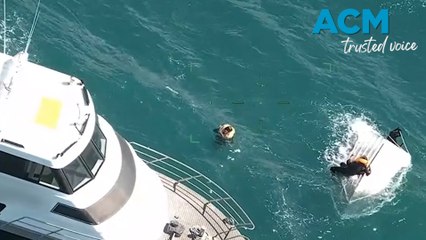 Close call for two men found clinging to capsized boat