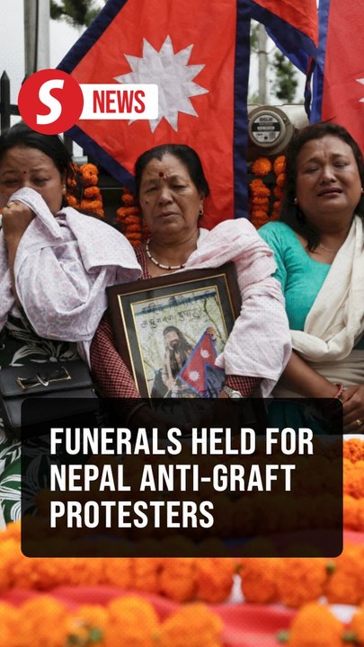 Nepalis weep at funerals for those killed in deadly anti-graft protests