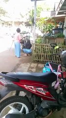 selling vegetables around on a motorbike