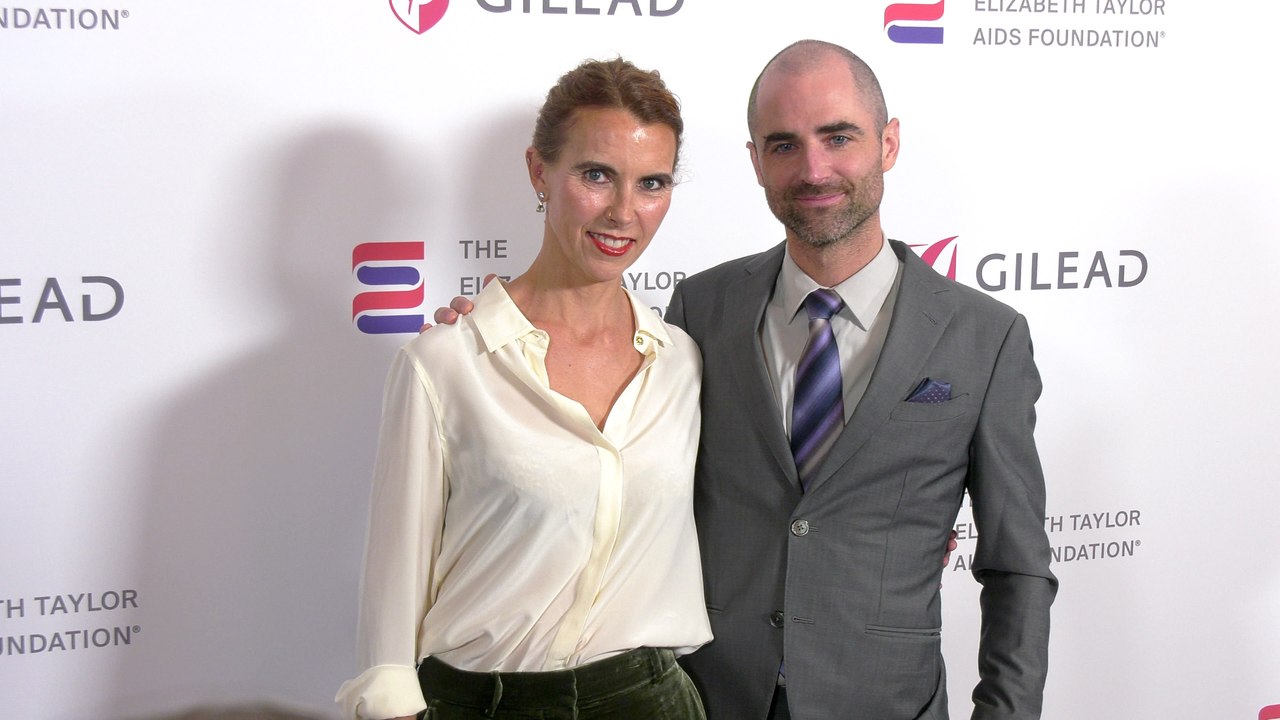 Naomi Wilding and Quinn Tivey attend "The Elizabeth Taylor Night of Compassion" purple carpet