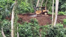 Bulldozer D6R XL Carves Mountain Slopes for New Roads