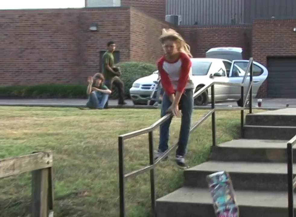 Skateboarder Falls After Losing Balance on Stair Railing