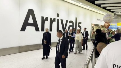 British couple freed in Afghanistan return to Heathrow
