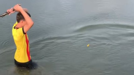 Lad proves fishing rods are not required as he successfully catches fish with a stick