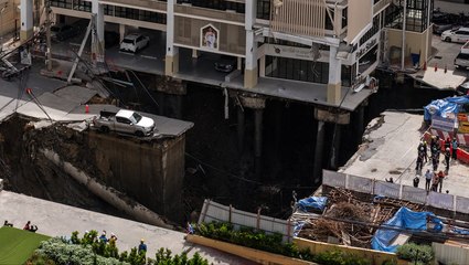 Watch: Massive sinkhole swallows Bangkok street as residents flee in panic