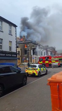 Fire fighters tackling large blaze in the centre of Blackpool with flames and smoke billowing from the roof