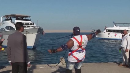 Egypt’s ‘strongman’ wrestler pulls ship using his teeth
