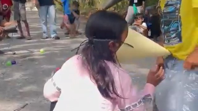 Indonesia: Cute Independence Day celebration moment as kids use cone hats as masks
