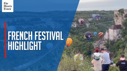 Hot-air balloons take flight over French medieval town