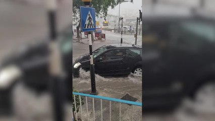 Cars Left Struggling to Drive Through Malta Storm