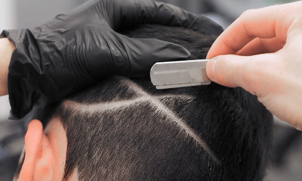 Fashionable haircut from a crafty master!  This barber has some cool techniques, you should watch it!