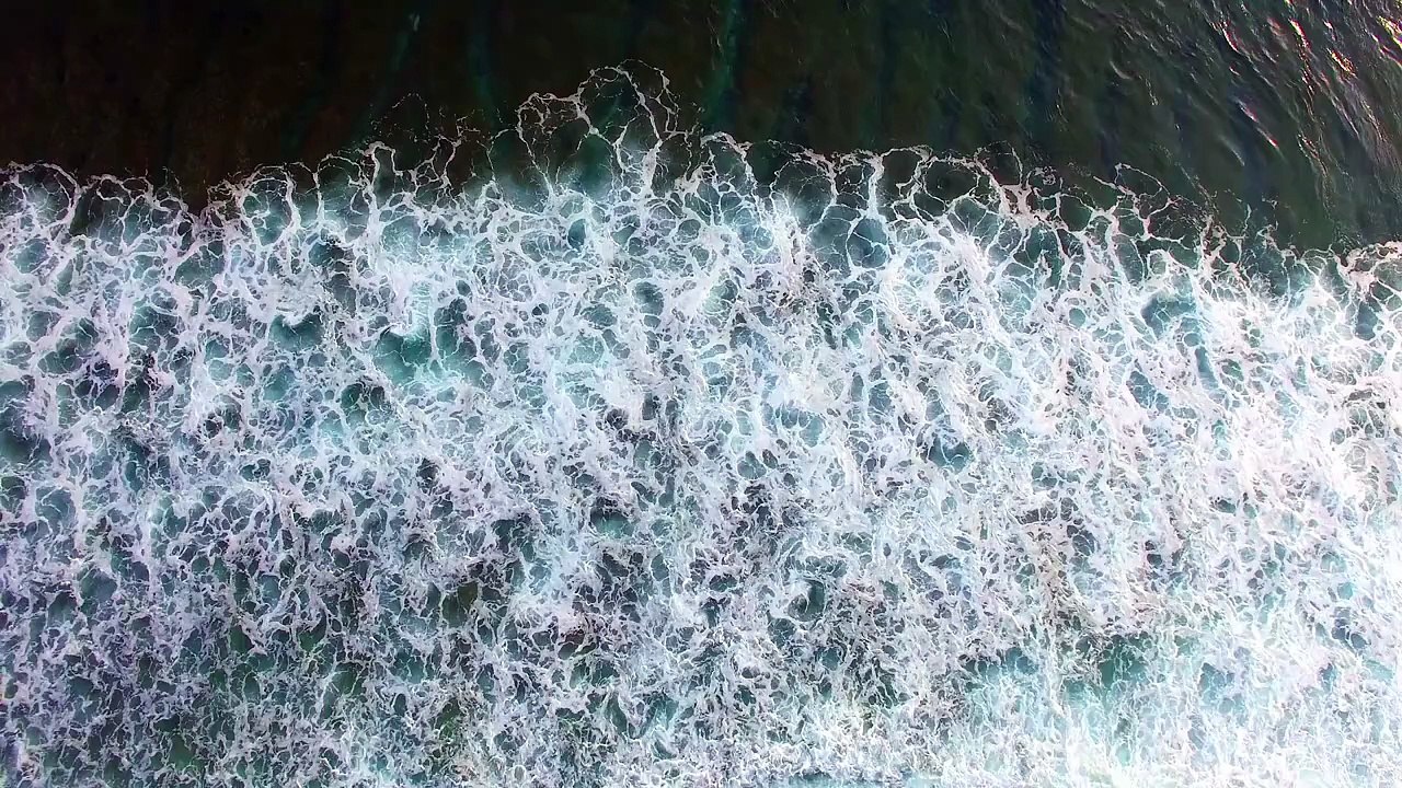 Flying Over Surfers in Picturesque Indonesian Bay