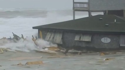 Beachfront homes collapse into the sea as hurricanes batter US coast