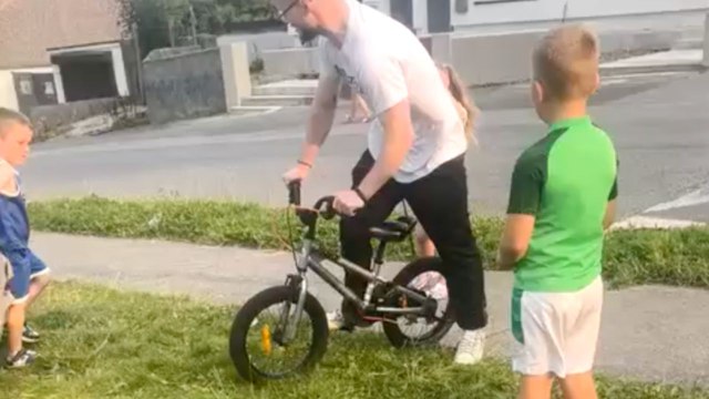 Boy rides a tiny bike downhill and ends up tumbling in hilarious fashion