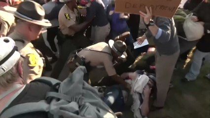 Scuffles, arrests at anti-ICE protest outside Chicago detention facility