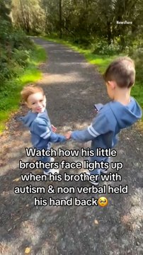 Touching Moment Non-Verbal Boy Reaches Out and Grabs His Little Brother's Hand