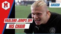 Haaland jumps off his chair after scoring for Manchester City in a videogame