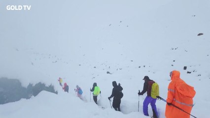An eyewitness video shows hikers wading through snow after a blizzard near Everest.