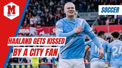 Haaland gets a kiss from a Manchester City after a big Premier League win