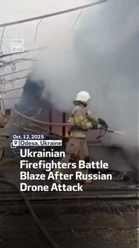 Ukrainian Firefighters Battle Blaze After Russian Drone Attack