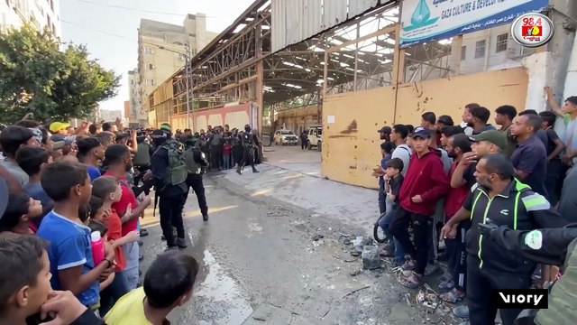 EXCLUSIVE! Hamas handover - Masked gunmen pass Israeli hostages to Red Cross