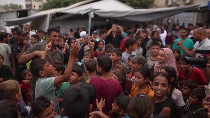 Gazans celebrate ceasefire deal, longing to return home