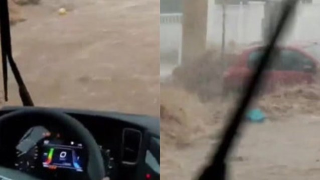 Trapped drivers battle raging torrents of mud water as flash floods rip through Spanish towns
