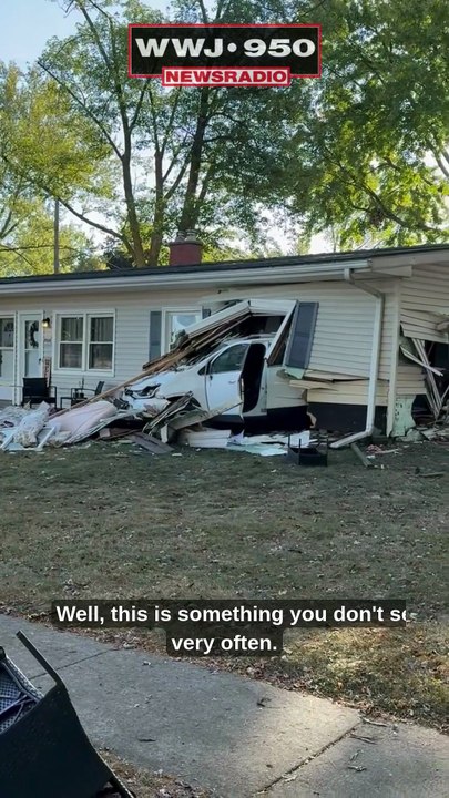 Car crashes through home in Center Line