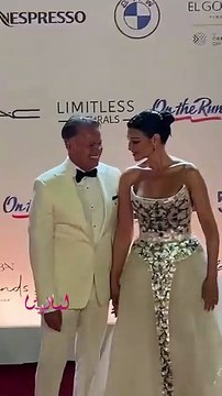 أروى جودة تتألق بفستان أبيض وبنظرات رومانسية بينها وبين زوجها على ريد كاربت الجونة