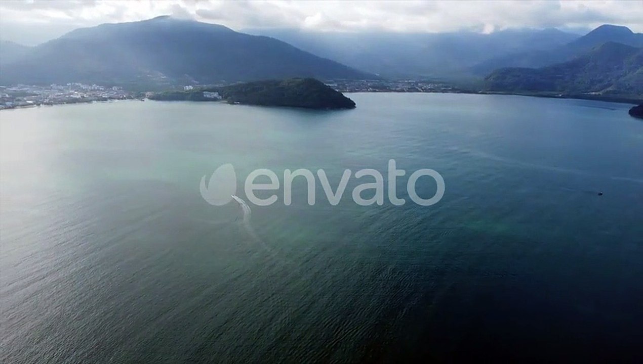 Ubatuba Central Aerial Shot. Tropical Beaches and Nature Covered Mountains. Ubatuba, Brazil By Drone