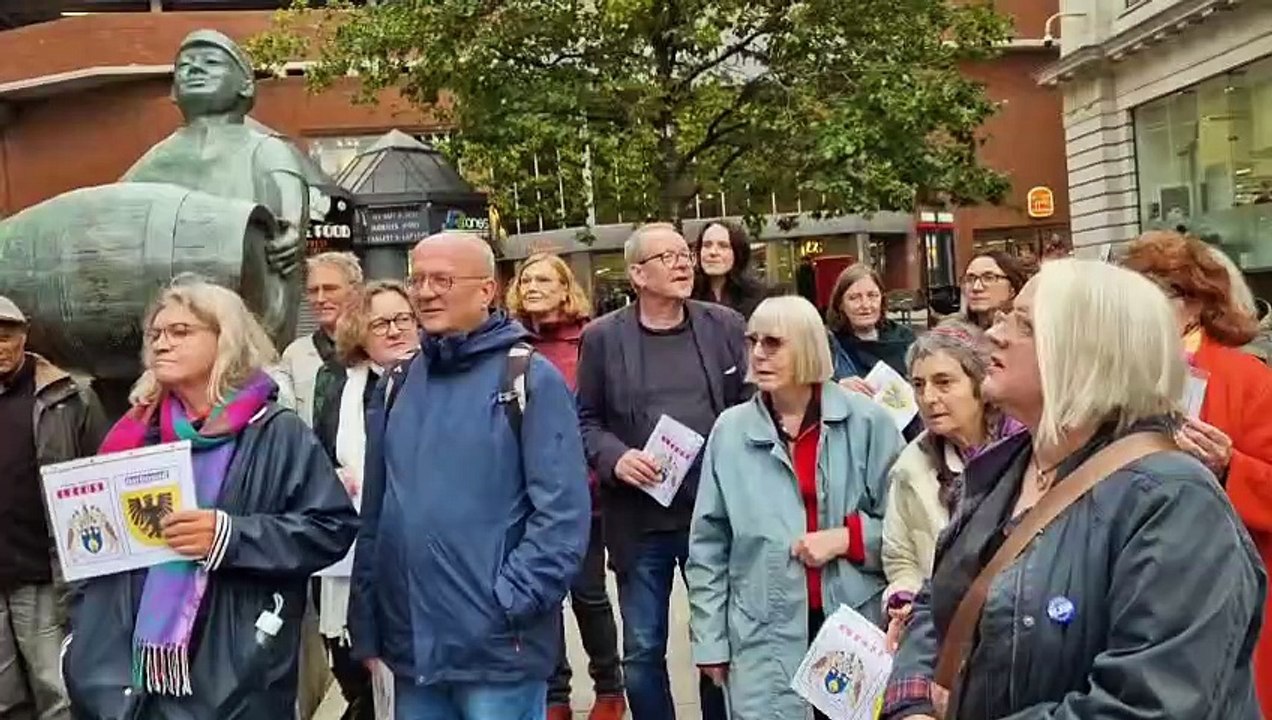 Leeds poet Ian Hacker performs 'Meet Me At The Man With The Barrel' to visitors from twin city Dortmund.