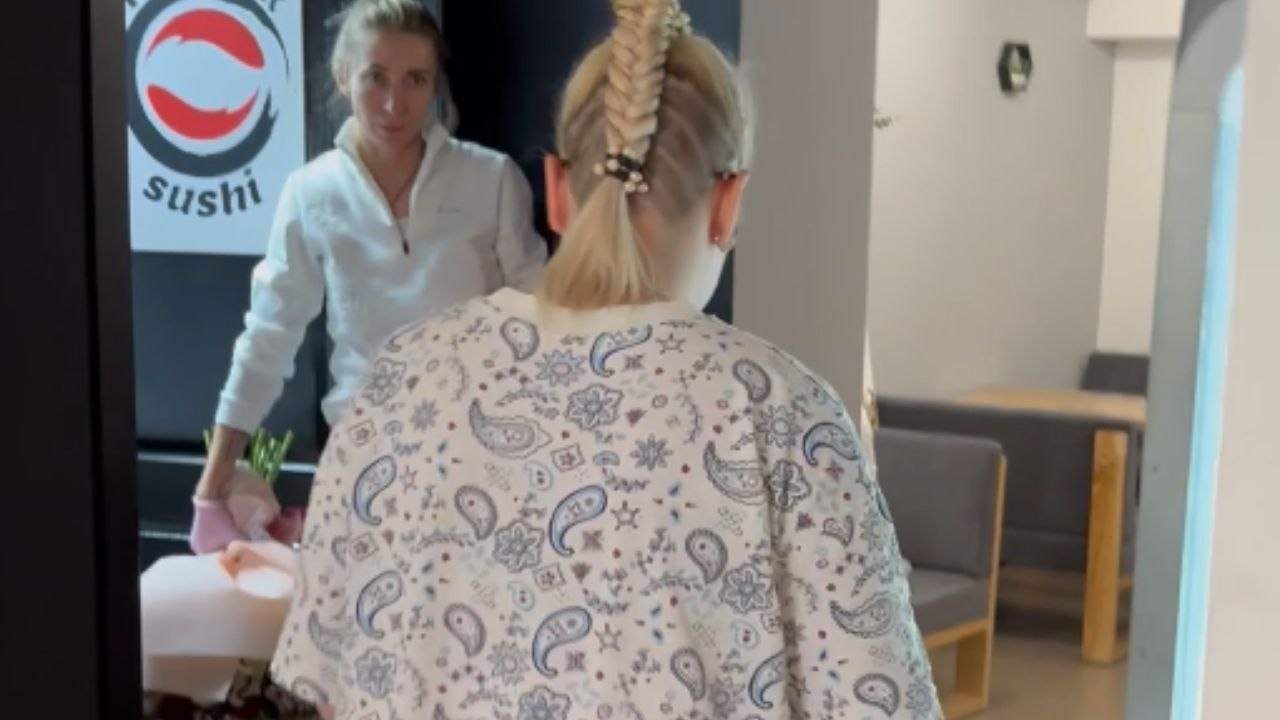 Video shows touching restaurant proposal where couple shares a joyful engagement moment