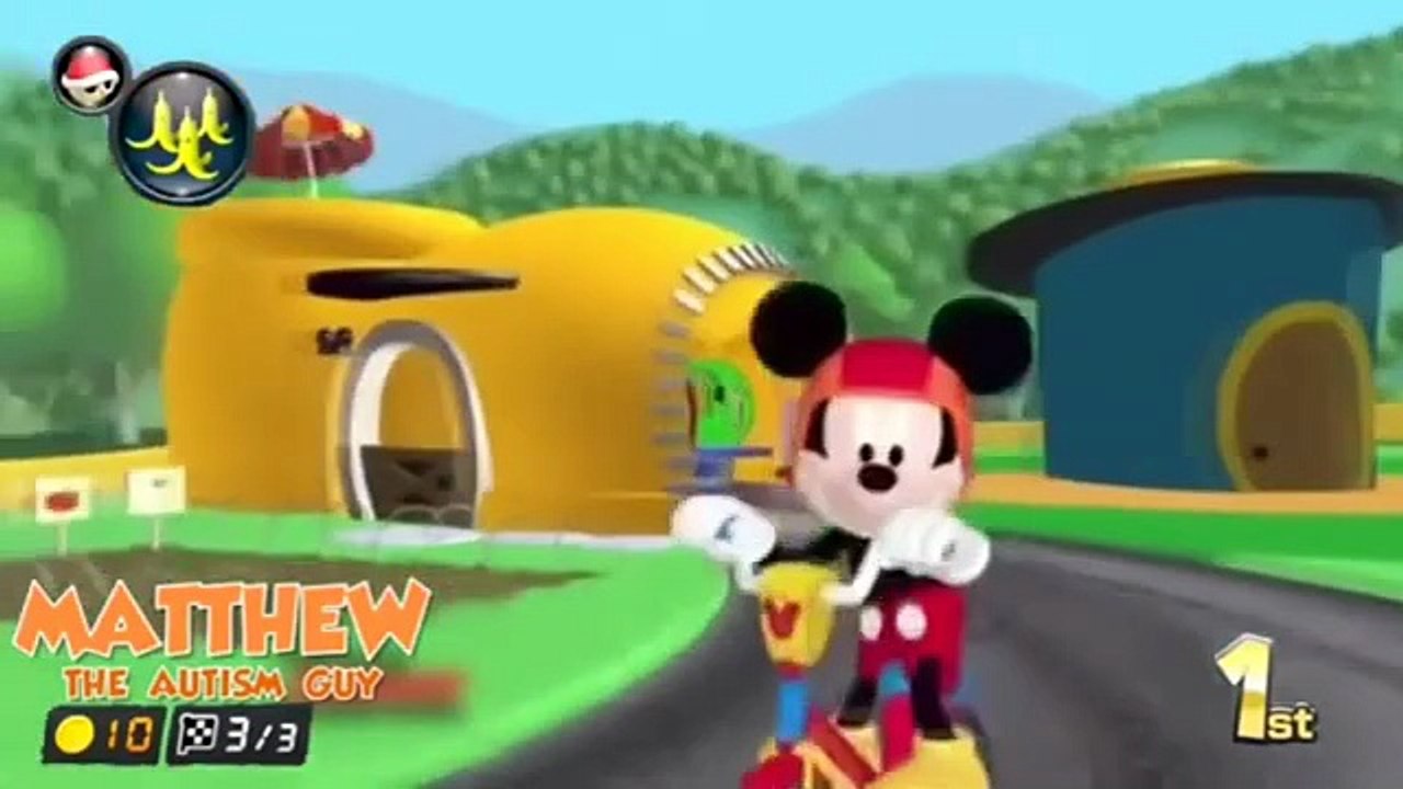 Mickey gets hit by a spiny shell while riding a bike