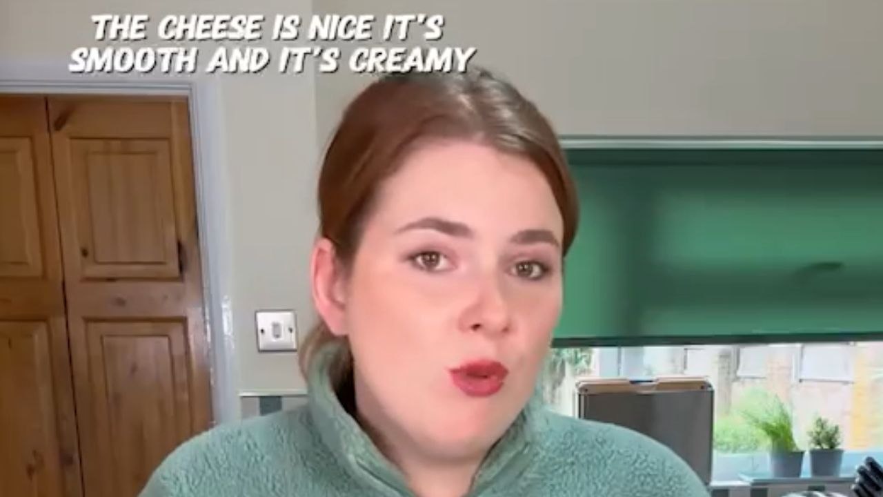 Woman reviews supermarket Cheddar cheeses