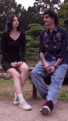 Couple Conversing in a Scenic Park