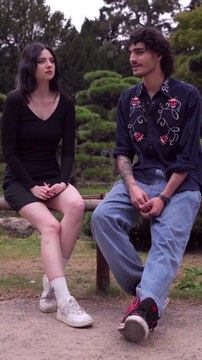 Couple Conversing in a Scenic Park