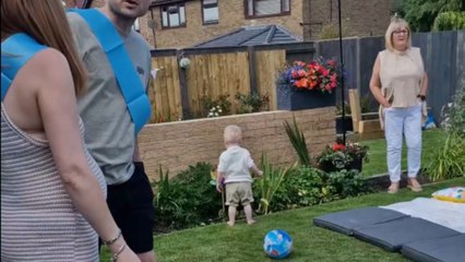 Gentleman proposes to his girlfriend at the baby shower for their second baby