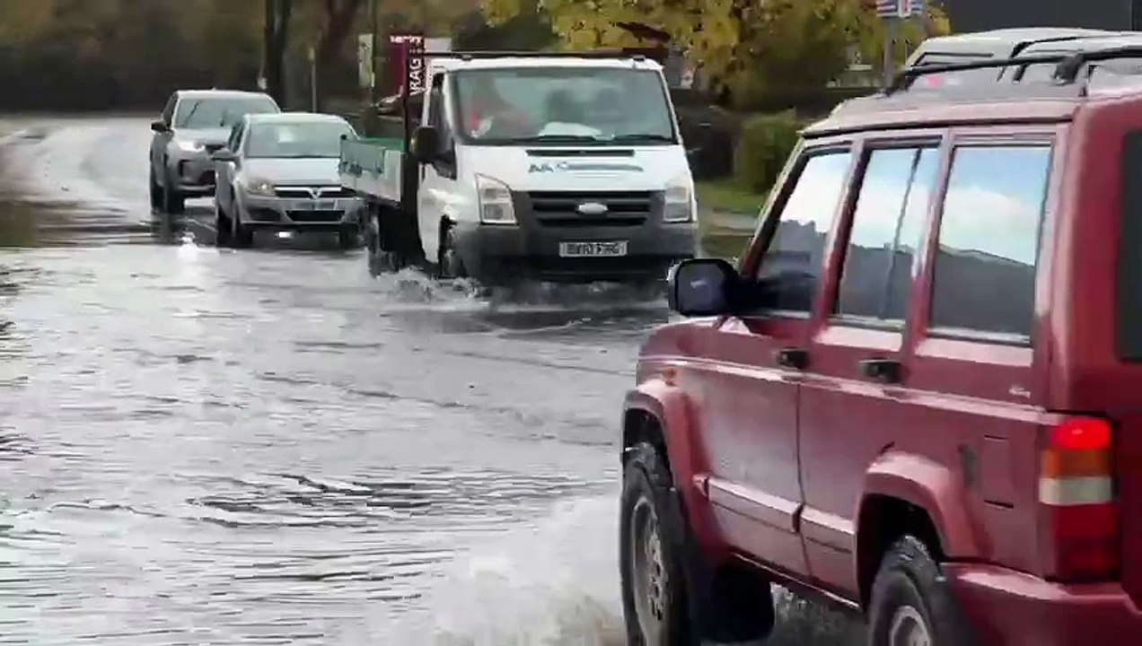 Cars derive through deep water in Chichester