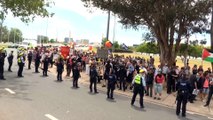 Anti-migration protestors and counter demonstrators clash in Canberra and across Australia
