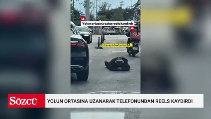 İstanbul'da bir şahıs, yolun ortasına uzanarak telefonundan reels kaydırdı
